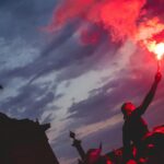 man holding red torch