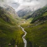 aerial photography of river between mountains